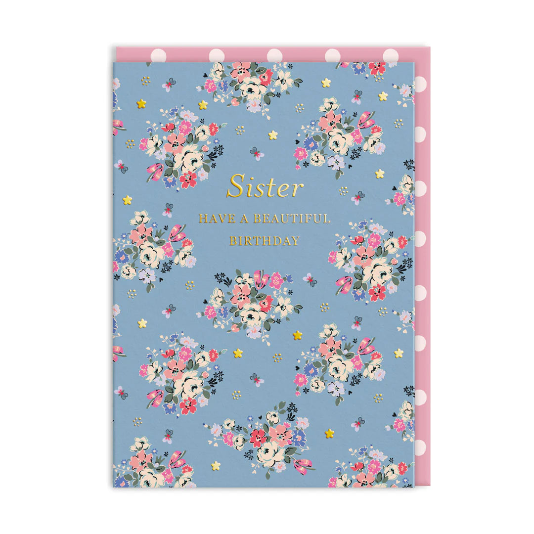 Floral birthday card with 'Sister, Have a Beautiful Birthday' text on a blue background