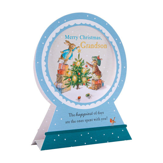 Christmas card with peter rabbit and friends decorating a tree, on a white background