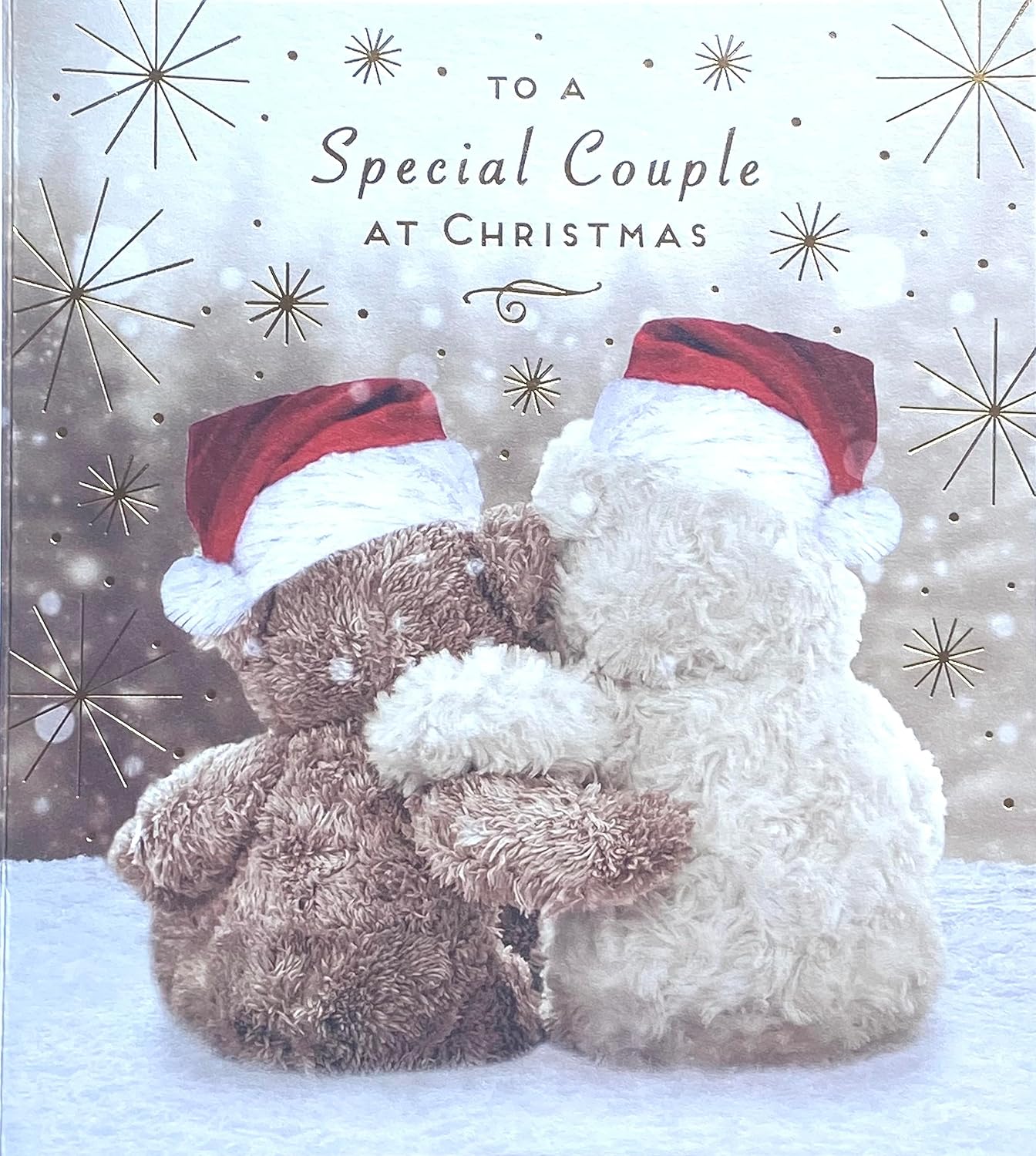 Christmas card with a teddy bear and snowman hugging, text 'To a Special Couple at Christmas', decorative background.