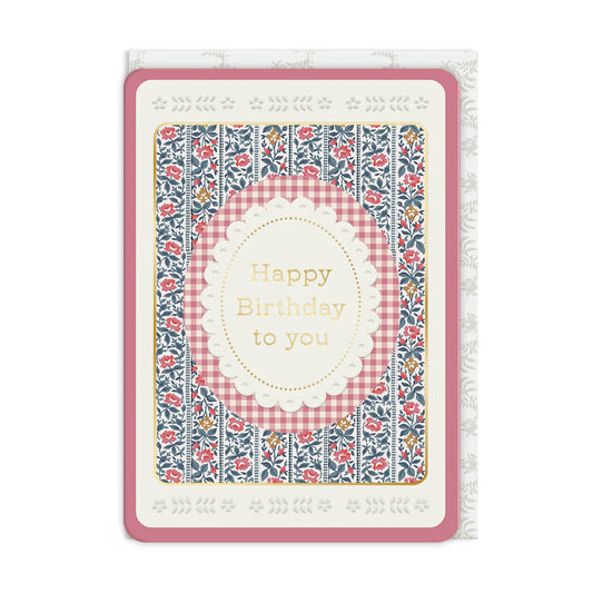 Birthday card with floral and checkered design on a white background
