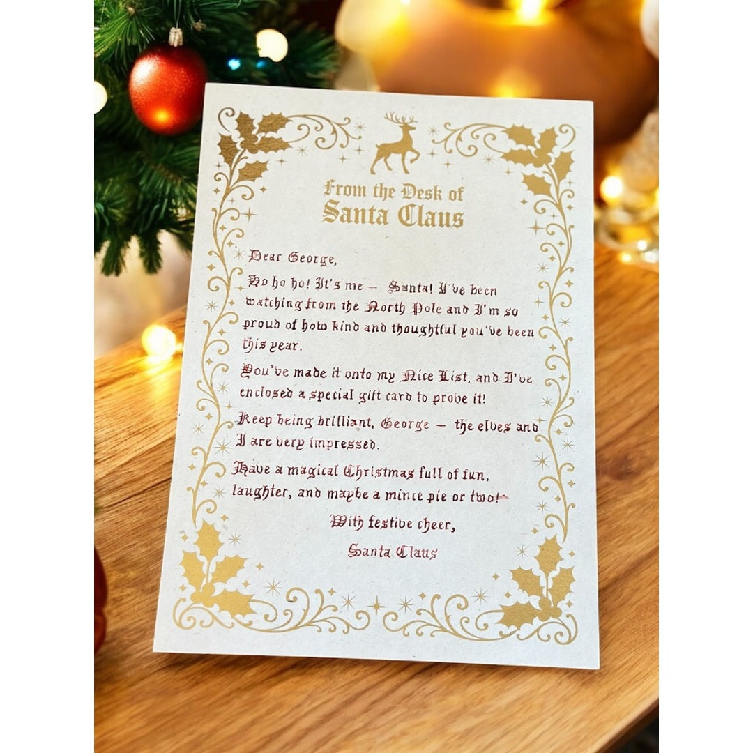 Luxury handwritten Santa letter with gold foil detail and festive holly border from Father Christmas.