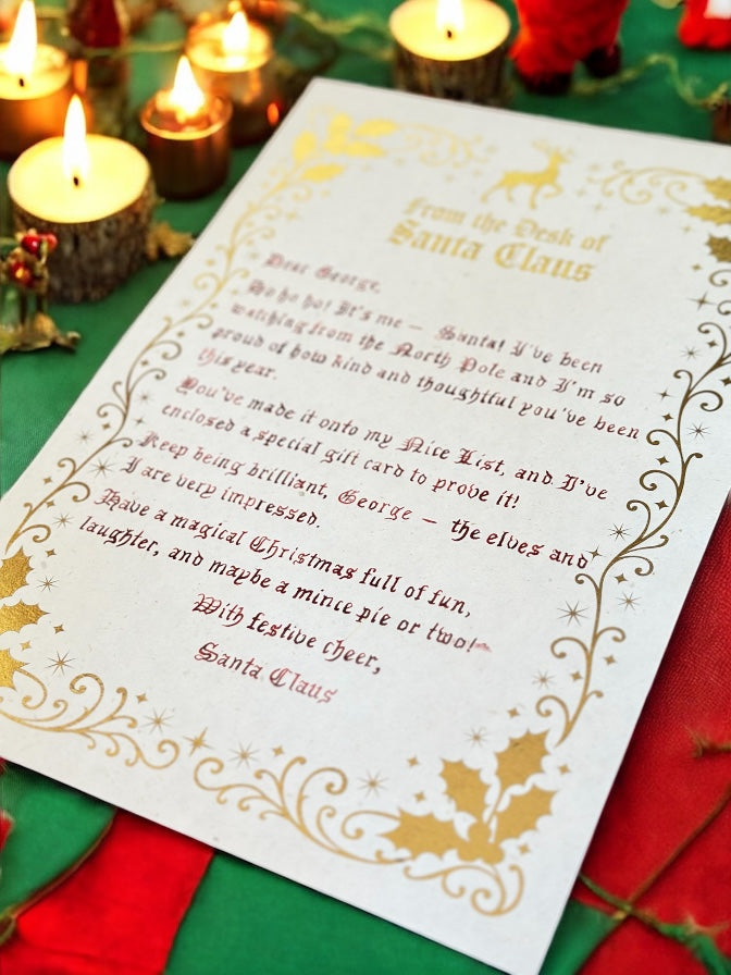 Letter from Santa Claus on a decorative paper with candles and Christmas elements in the background

