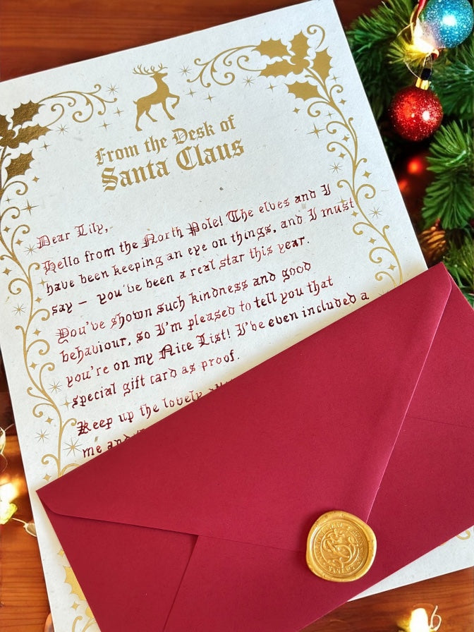 Letter from Santa Claus with red envelope and gold seal on a festive background