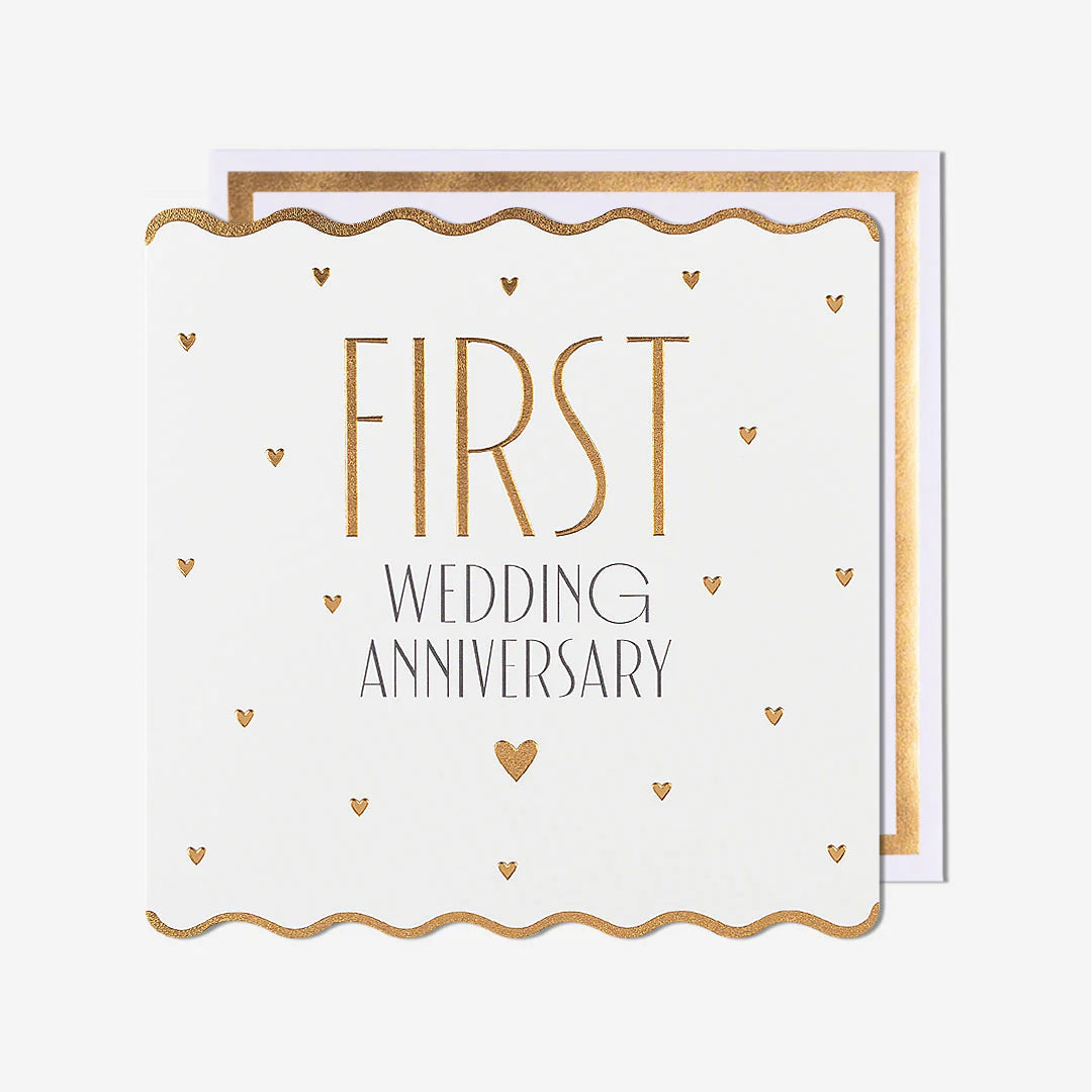 Greeting card with 'First Wedding Anniversary' text on a white background