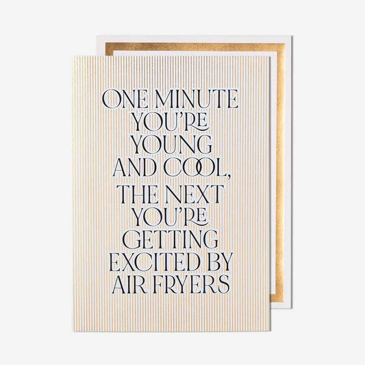 Card with humorous text about age and air fryers on a white background