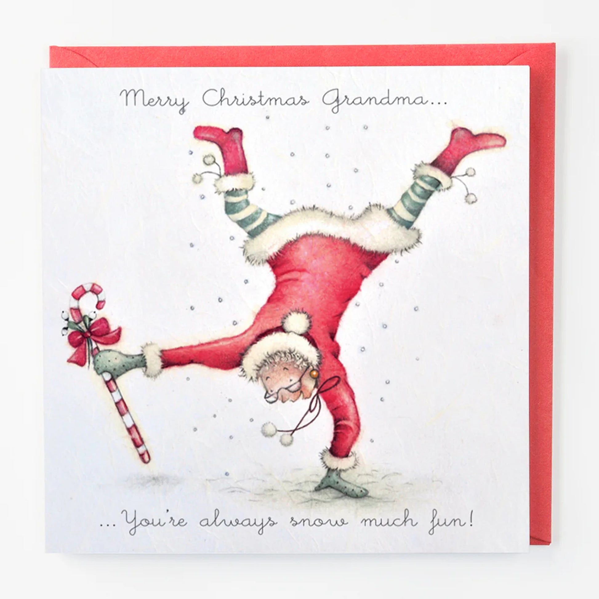 Christmas card with a person in a red outfit doing a handstand, holding a candy cane, with text 'Merry Christmas Grandma.