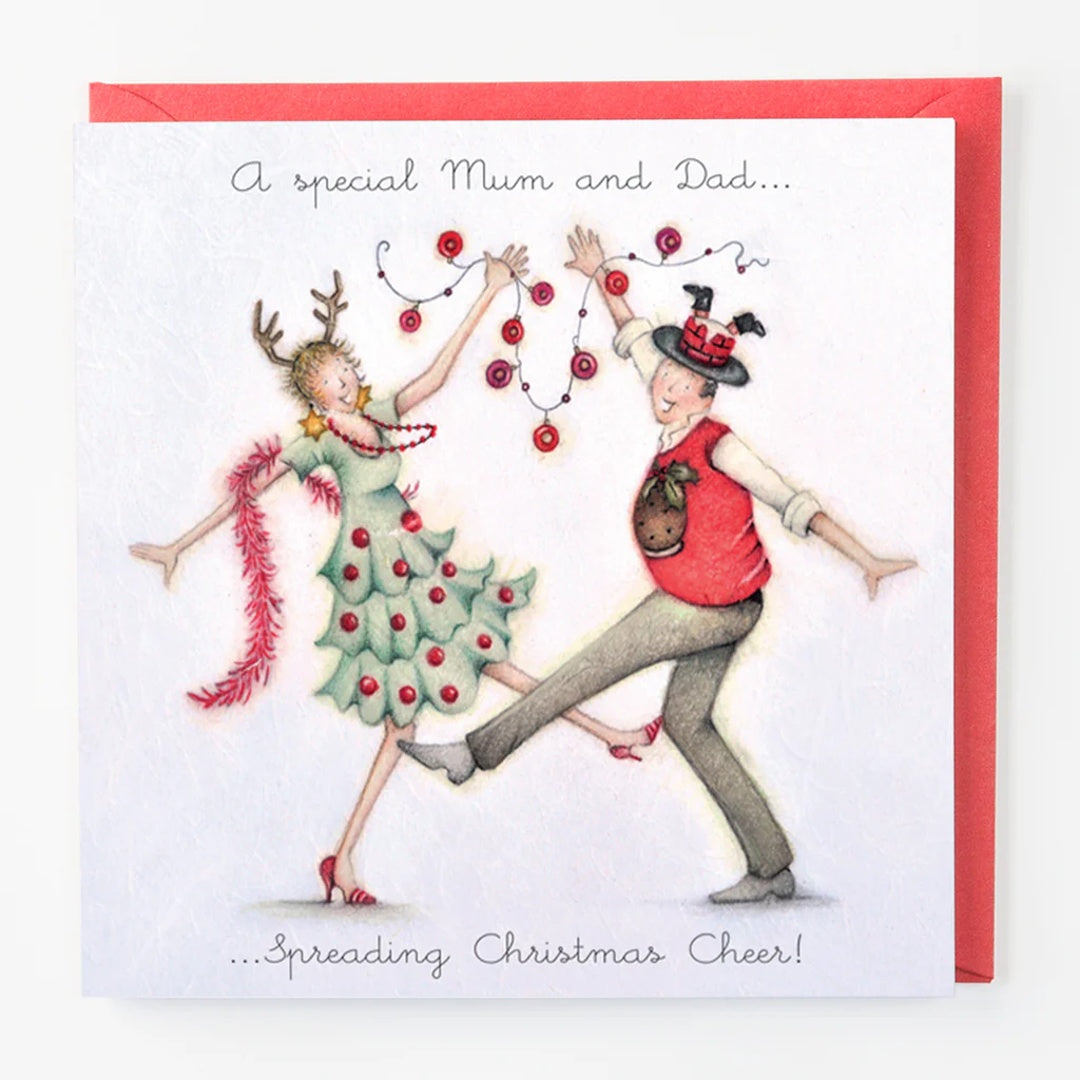 Christmas card with a couple dancing, decorated like Christmas trees, on a white background with red border.
