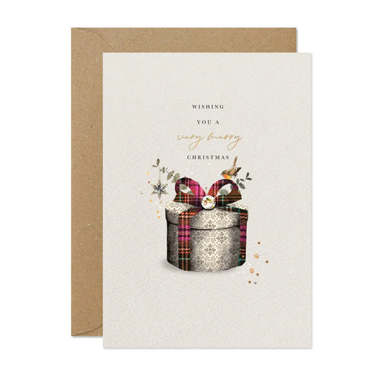 Christmas card with a gift box and plaid ribbon on a white background